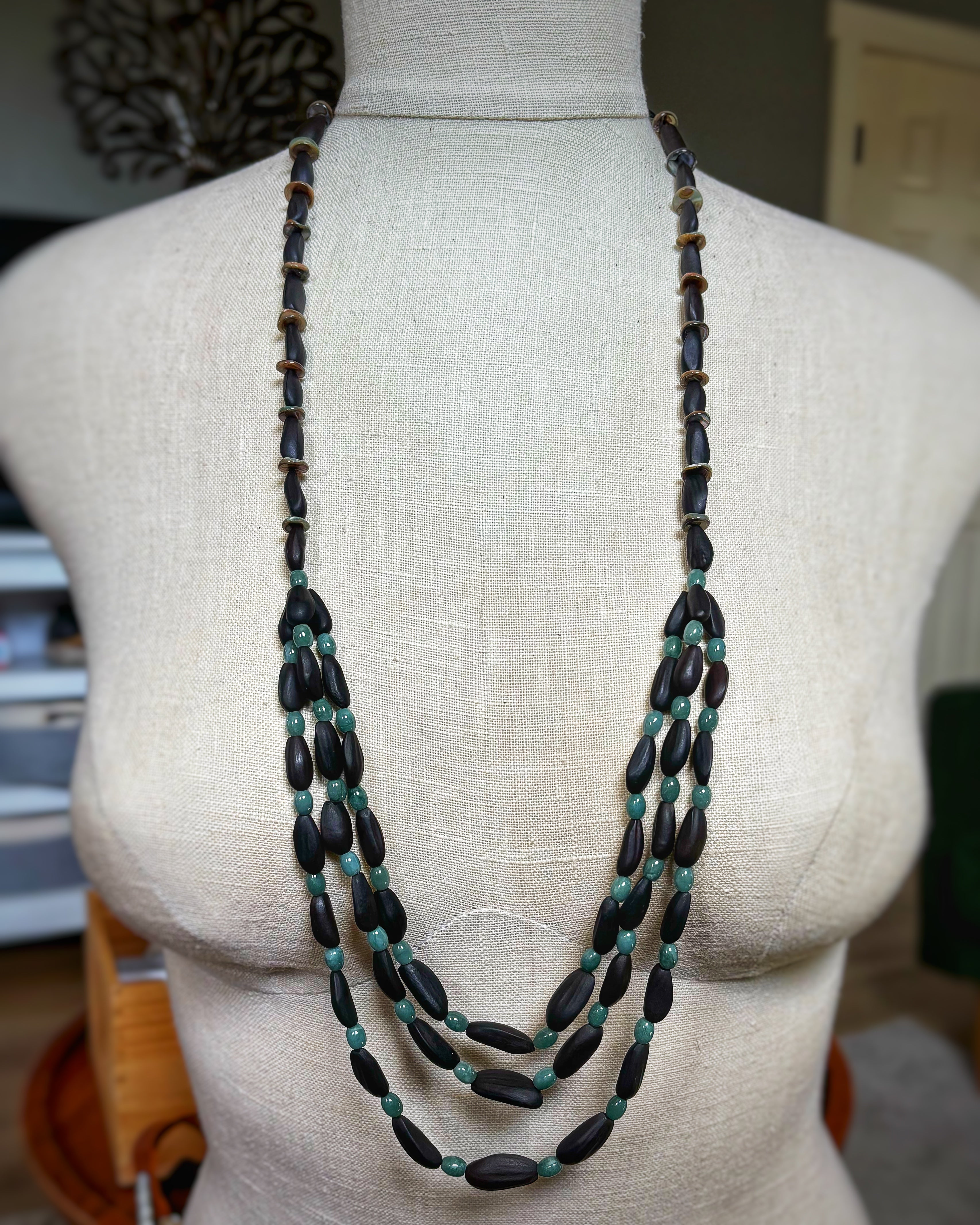 Three Half Strand Pinenut, Jade, and Abalone Necklace with layered dark pinenut beads and smooth green jade accents