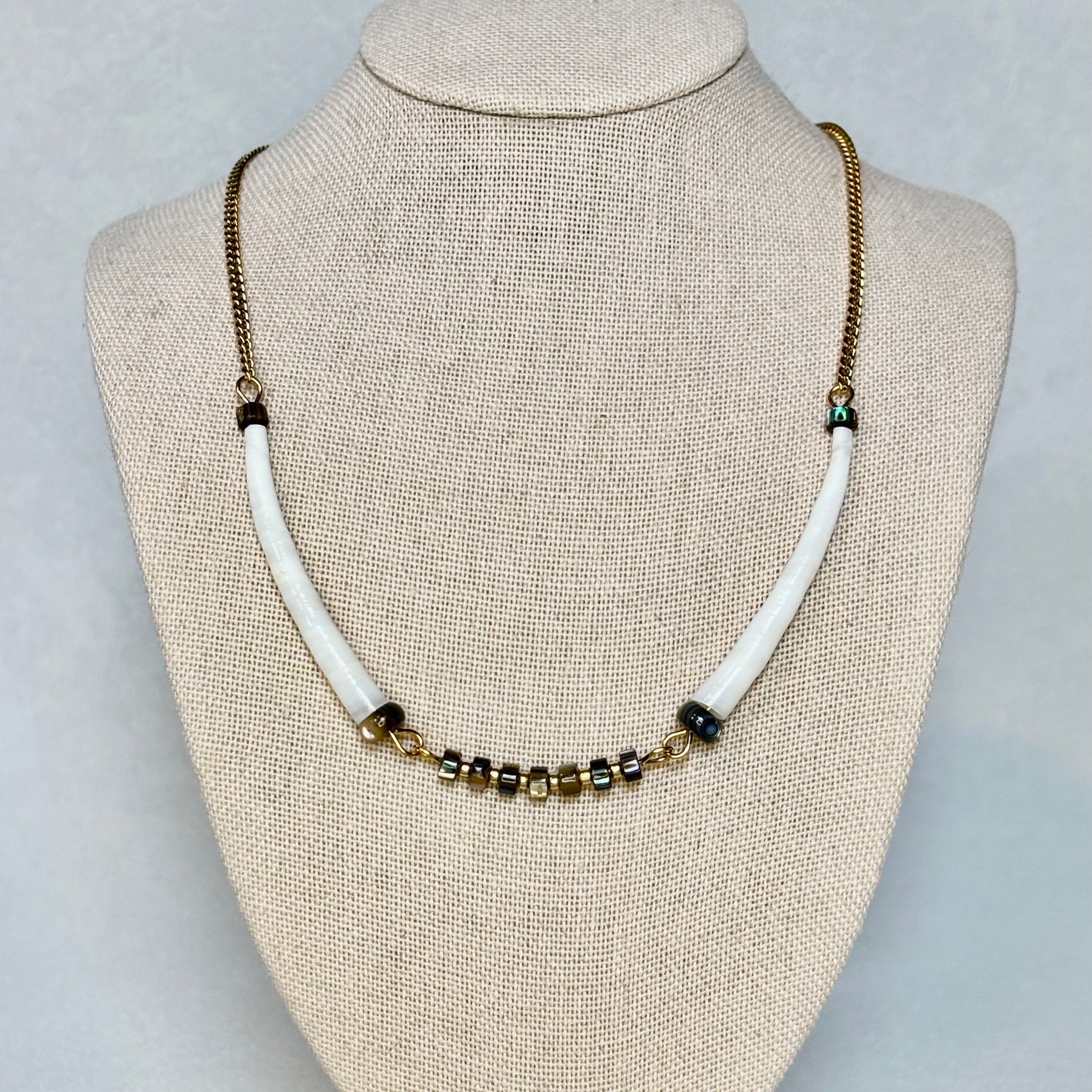 Dentalium and Abalone Gold Set 1 necklace with white dentalium beads and small metallic accents on gold chain, gallery position 1