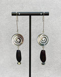 Black Lip Swirl Dangles featuring silver spiral tops with dark elongated beads and small round accents on silver hooks