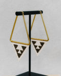 Medium Triangle Hoops featuring gold-tone triangular frames with black and white handmade beaded triangle accents
