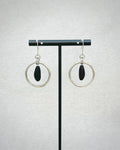 Pinenut Steel Dangles with polished silver hoops framing dark beaded pinenut-shaped accents on delicate hooks