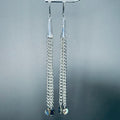 Silver Chain Cone Dangles with Abalone featuring sleek steel cones and chains with round abalone accents at the ends