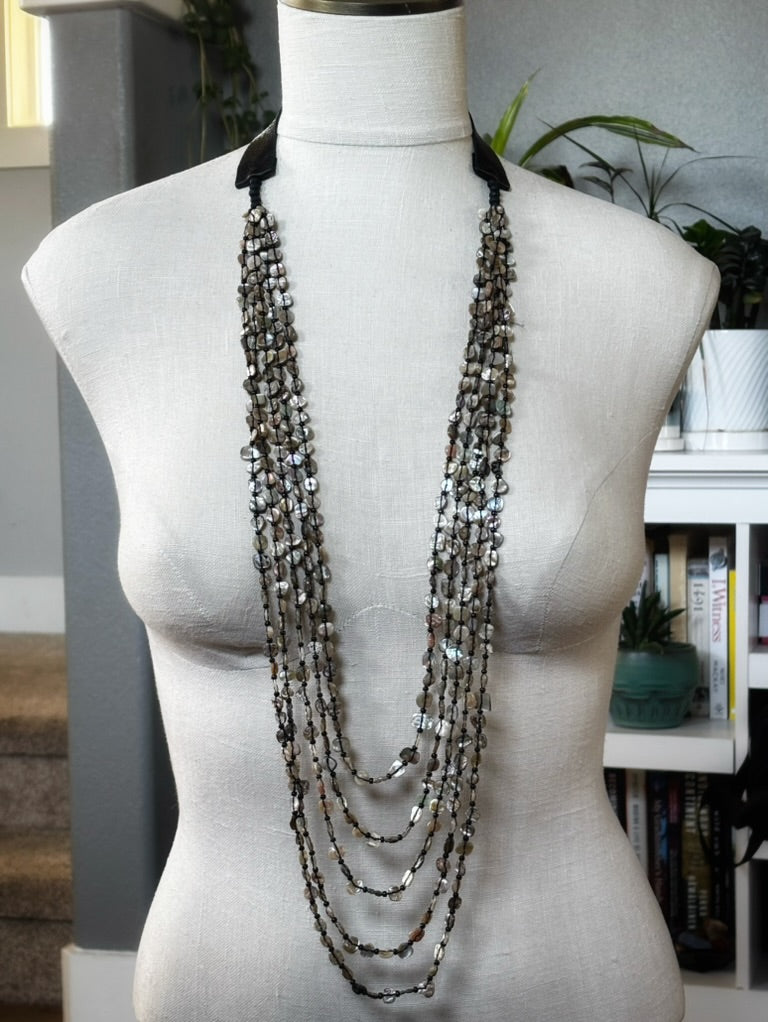 5 Strand Red Abalone Nugget Necklace displayed on a mannequin with natural light and indoor plants in the background