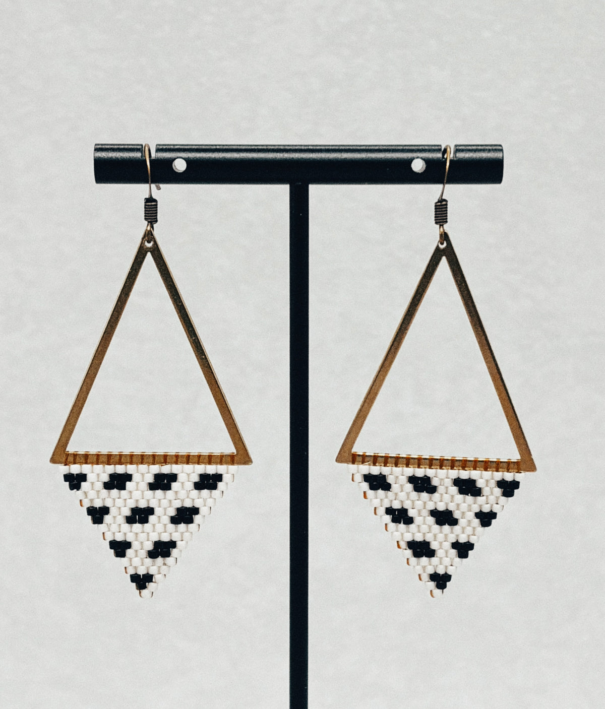 Bronze Triangle Dangles with geometric bronze frames and black and white beaded fringe earrings