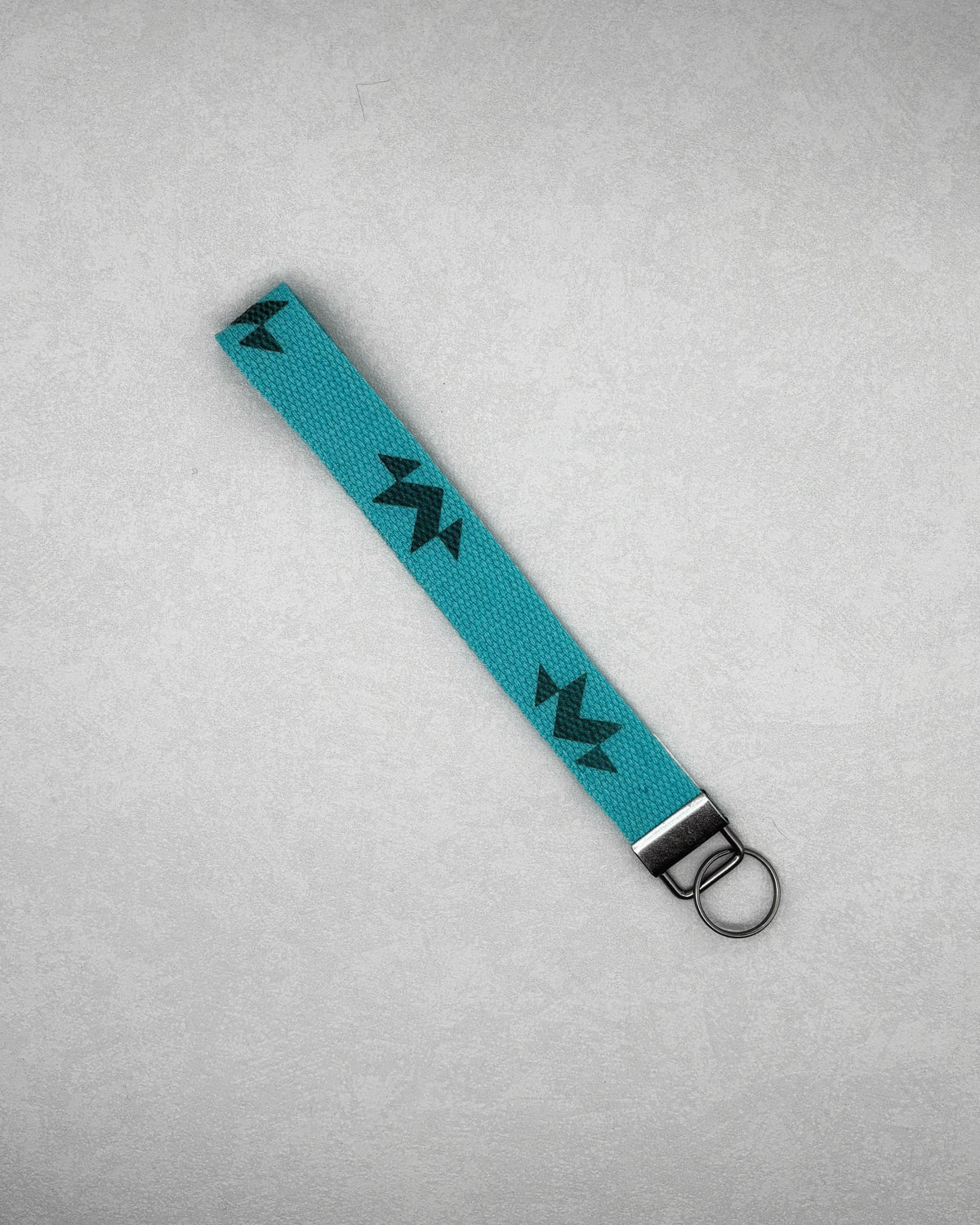 Wristlet Keychains turquoise fabric keychain with black geometric pattern and silver metal ring