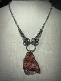 Steel and Abalone Necklace 1 featuring a chainmail steel chain with a natural abalone and reddish shell pendant