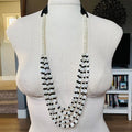 Black and White Shell and Glass Five Half Strand Necklace featuring layered white shell beads and black glass beads on display bust