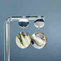 Abalone Coin Silver Circle Studs featuring iridescent abalone coin pendants hanging from polished silver circle studs