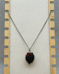 Blackberry Necklace featuring a detailed black and red berry pendant on a silver-tone chain display