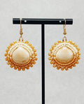 Two-Tone Tan Beaded Clamshell Dangles featuring circular cream clamshell centers with tan beaded borders in handmade style