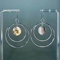 Silver Steel Double Hoops with Abalone Coins featuring iridescent natural shell accents and sleek polished steel hoops.