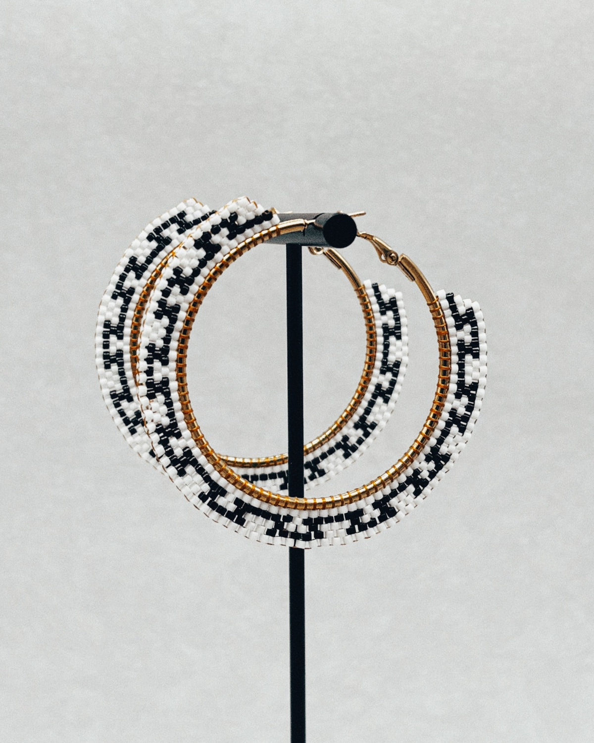 Brick Stitch Hoops black and white handmade beaded earrings with a geometric pattern