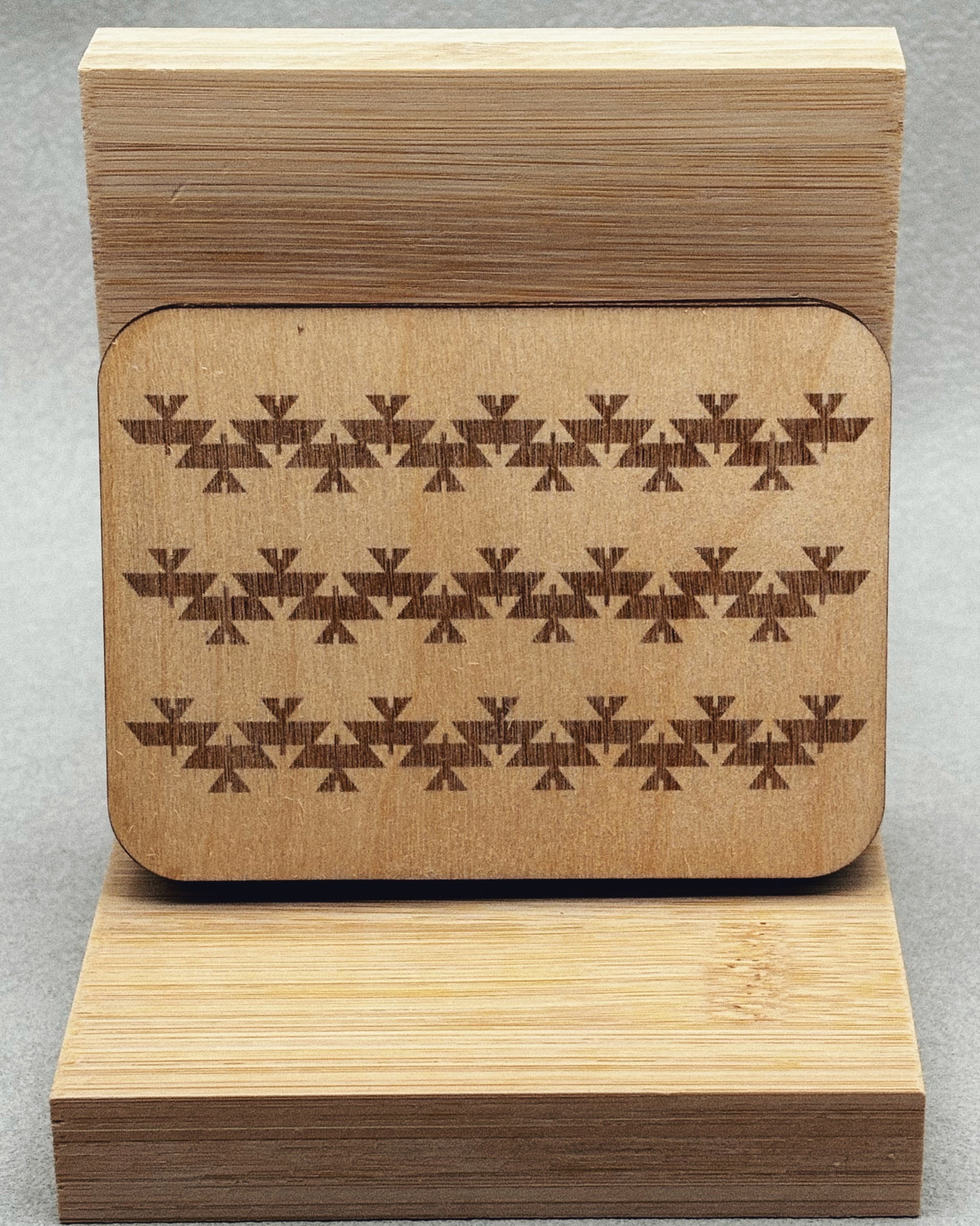 Needle Keepers wooden box with intricate geometric indigenous pattern engraved on smooth light wood surface