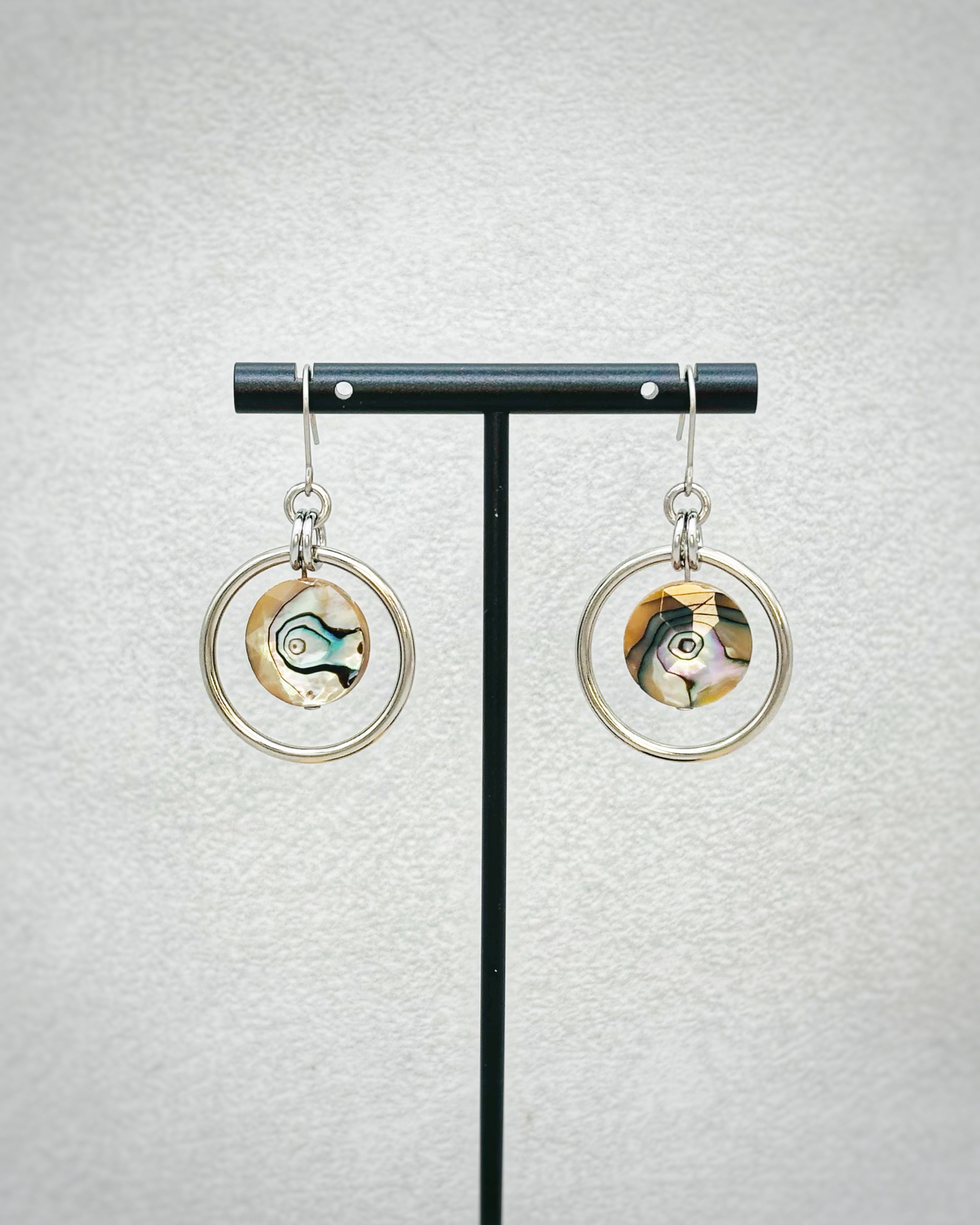 Faceted Abalone Steel Dangles with iridescent shell discs inside polished silver open circles on delicate hooks