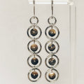 Abalone Sphere Silver Dangles featuring five linked silver rings each holding a polished abalone sphere bead.