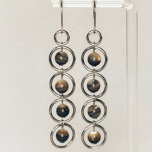 Abalone Sphere Silver Dangles featuring five linked silver rings each holding a polished abalone sphere bead.