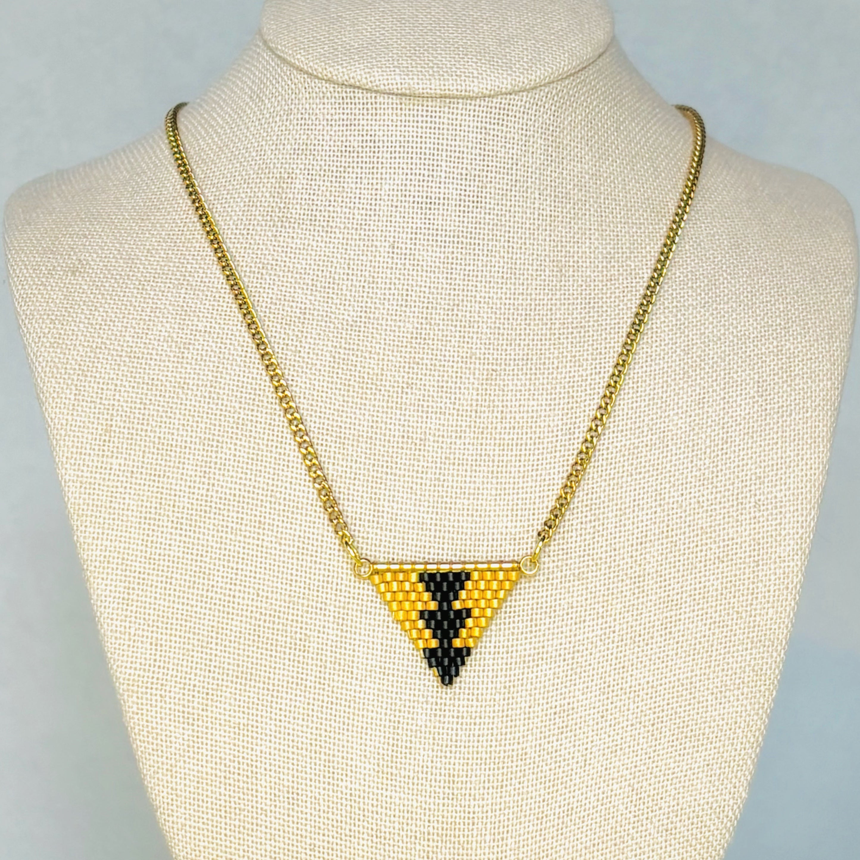 Black and Gold Sturgeon Beaded Necklace with small geometric triangular pendant in black and gold beads gallery position 1
