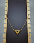 Black and Gold Crab Beaded Necklace with a triangular black and gold beaded pendant