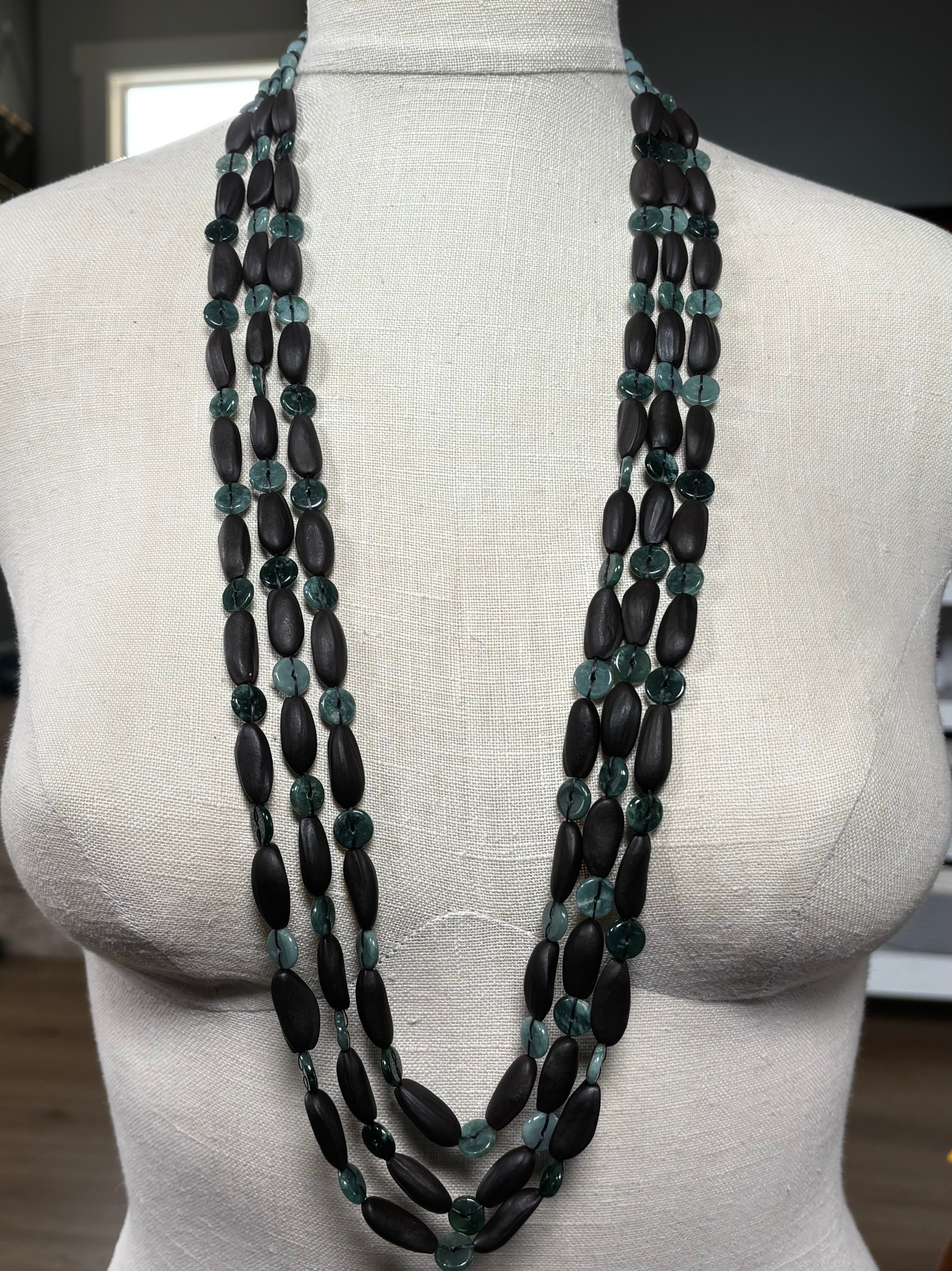 Three Strand Jade, Pinenut, and Lava Rock Necklace displayed on a mannequin showing rich textures and earthy tones.