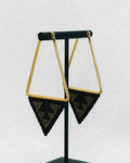 Medium Triangle Hoops featuring gold-tone triangular frames with black and gold geometric handmade beadwork accents
