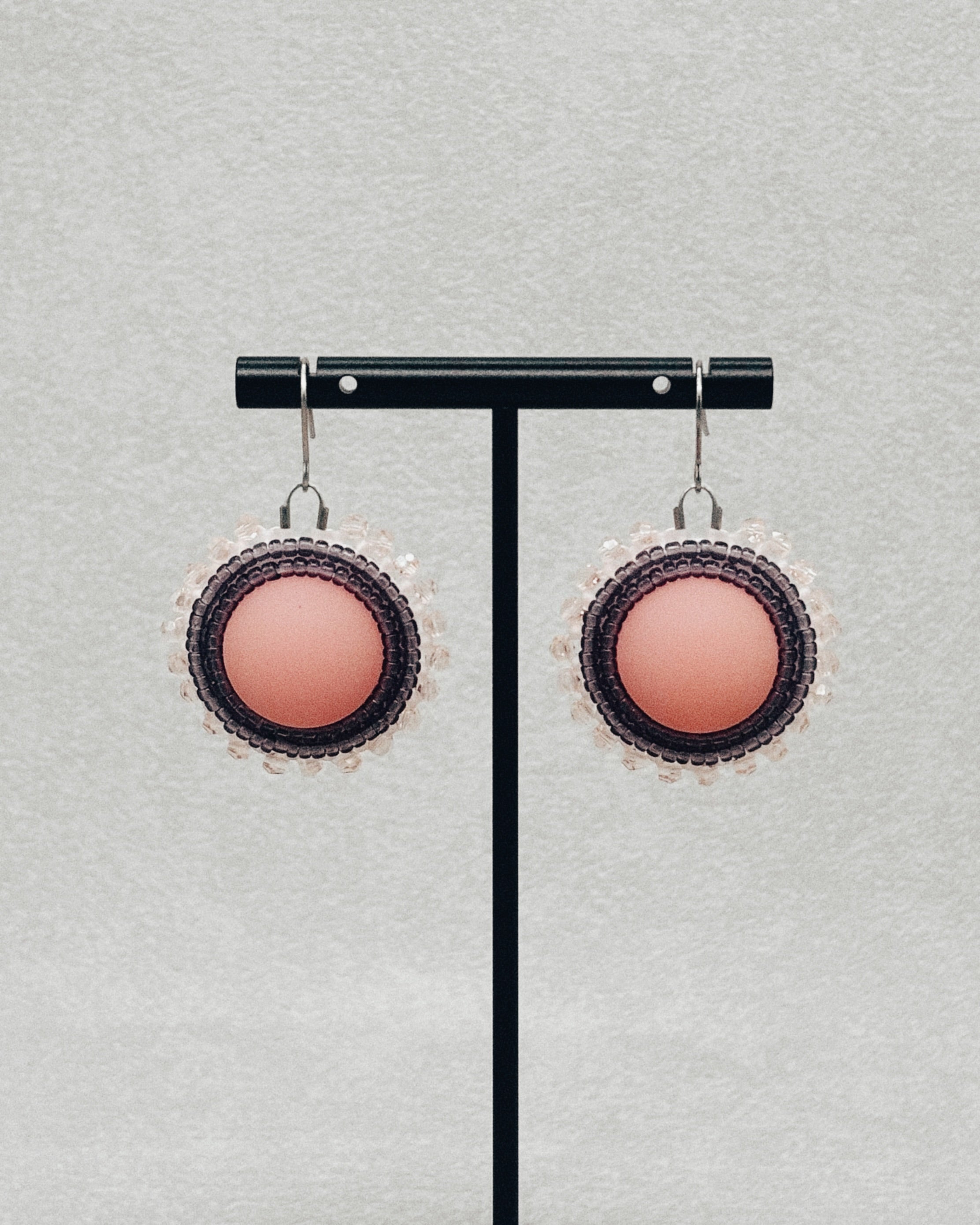 Pink and Purple Beaded Dangles with circular pink centers and layered dark beadwork