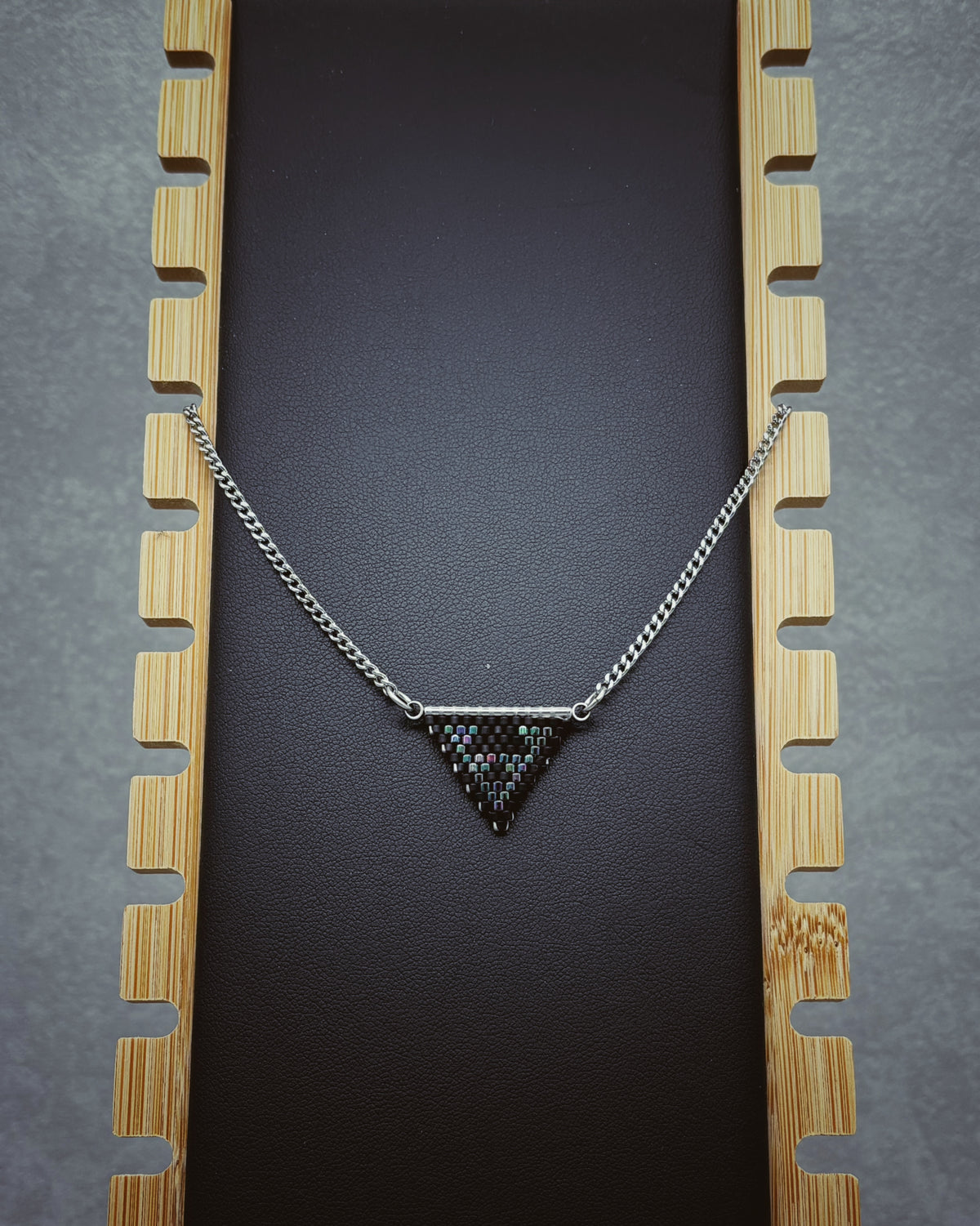 Rainbow and Matte Black Crab Beaded Necklace with triangular beaded pendant and silver chain