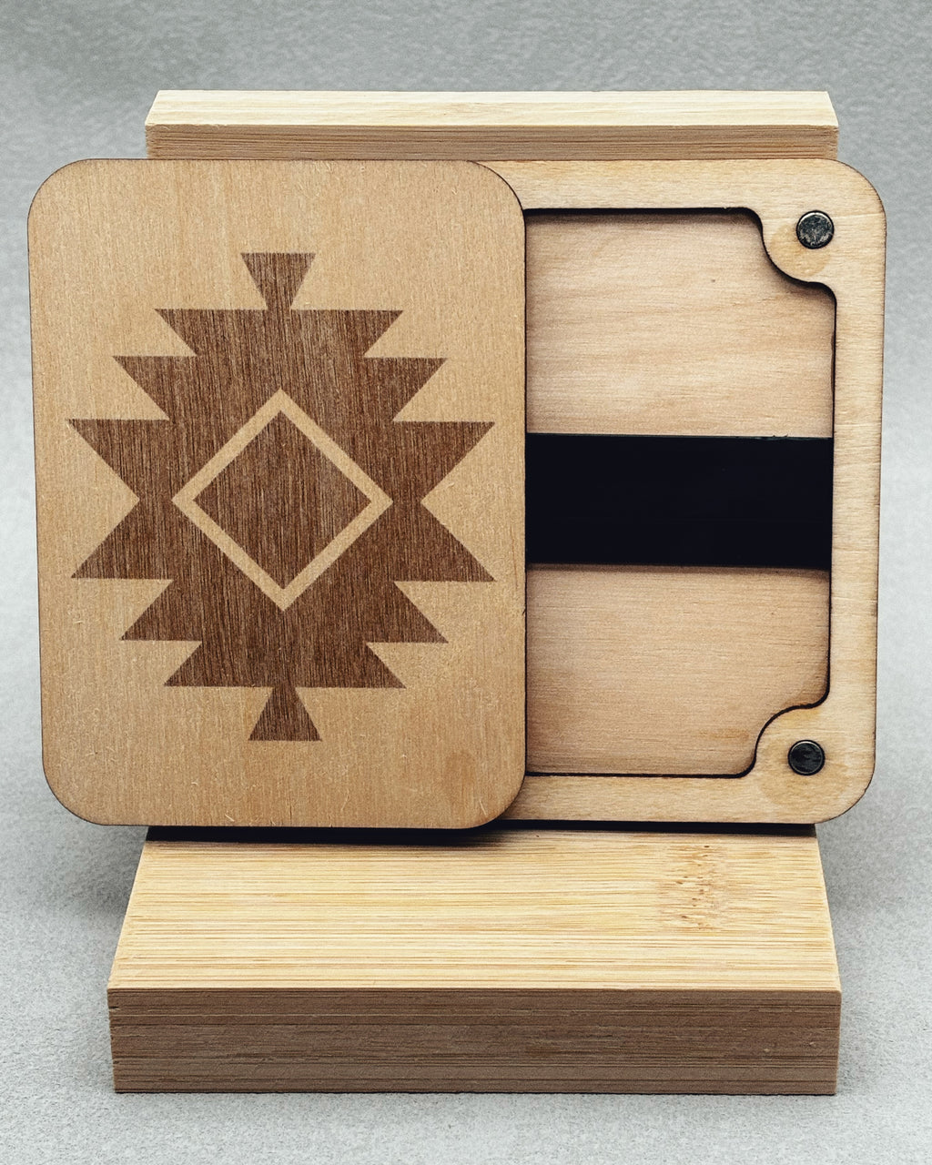Needle Keepers wooden box with engraved central diamond and stepped geometric pattern on natural light wood surface