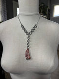 Steel and Abalone Necklace 7 featuring a steel chainmail design with a unique pink abalone pendant hanging from center