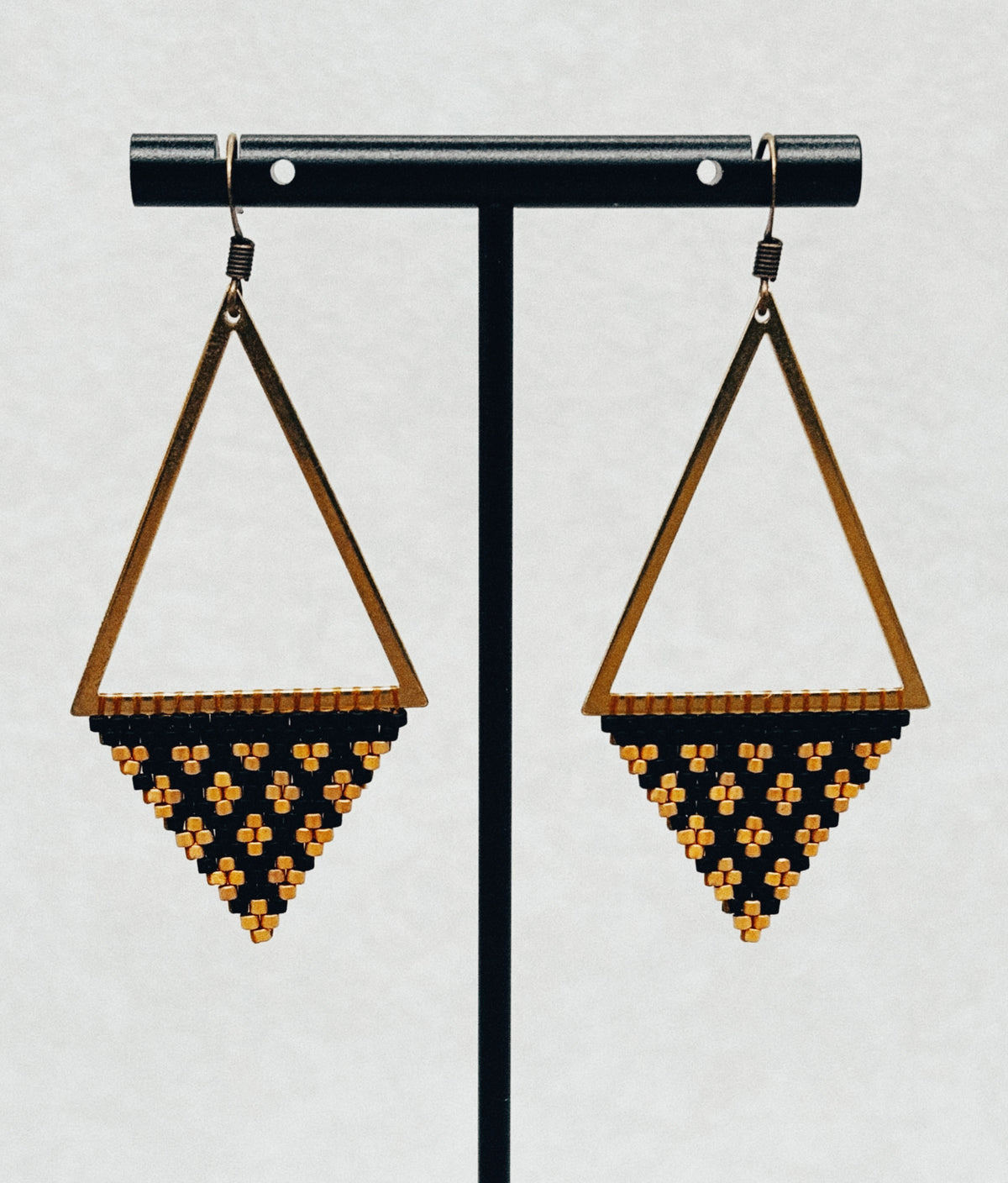 Bronze Triangle Dangles featuring geometric bronze triangles with black and amber beaded drops