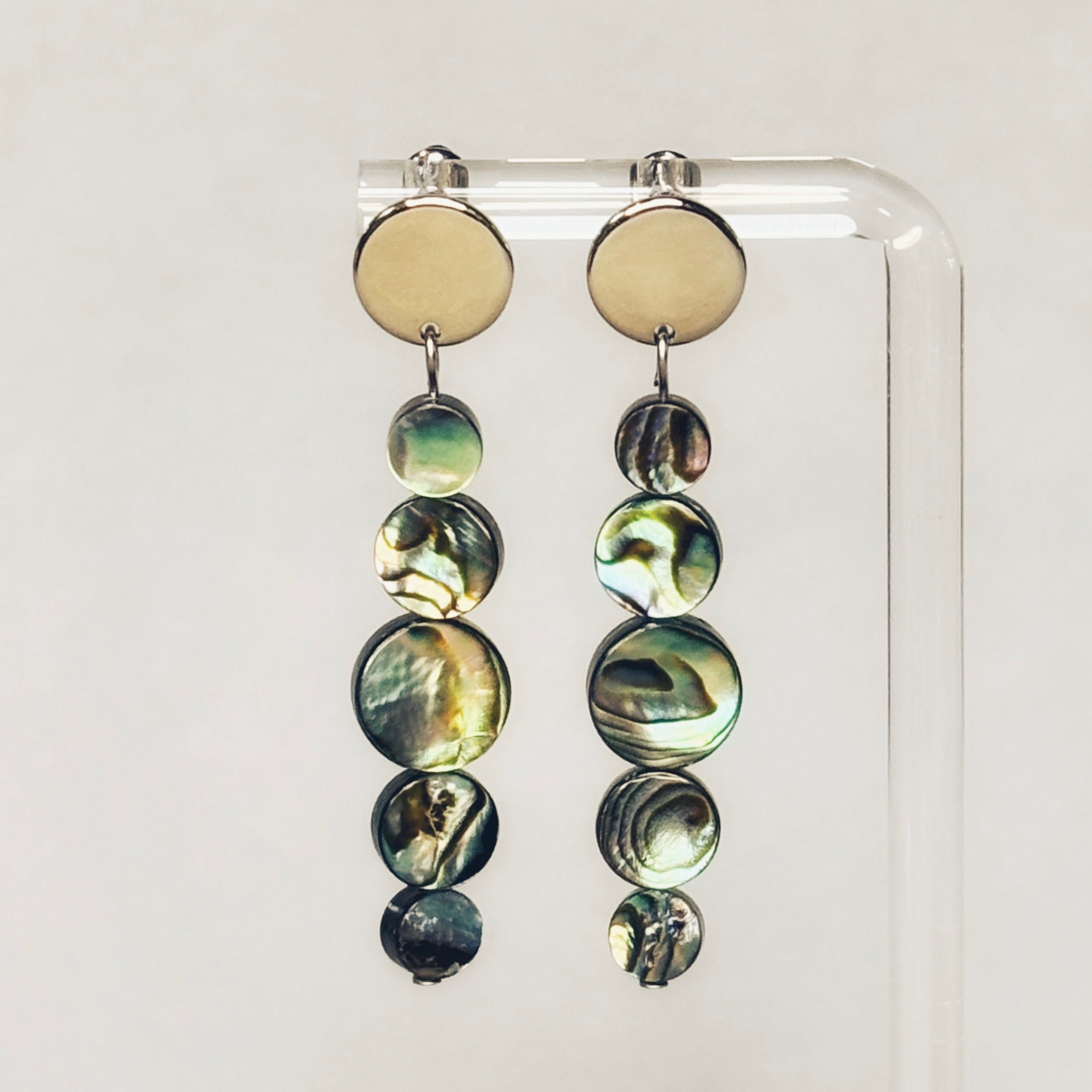 Abalone Graduated Abalone Coin Silver Circle Studs showing layered abalone coins in five sizes hanging from silver round studs gallery image 1