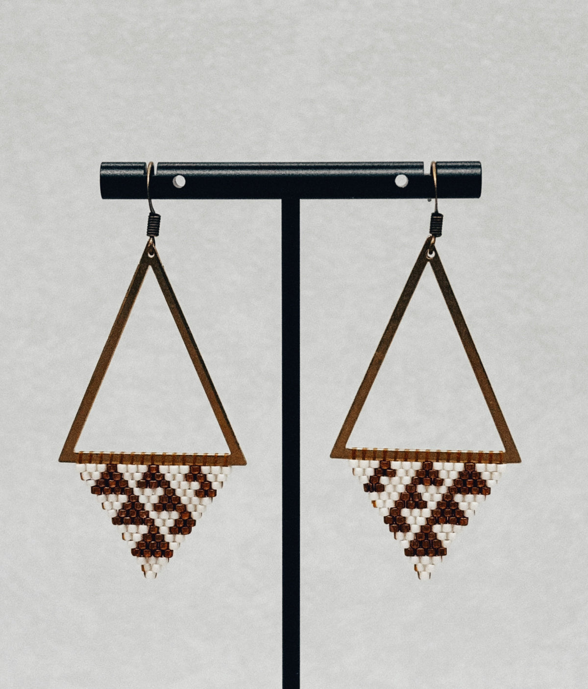 Bronze Triangle Dangles handmade beaded earrings with triangular bronze frames and brown and white beadwork