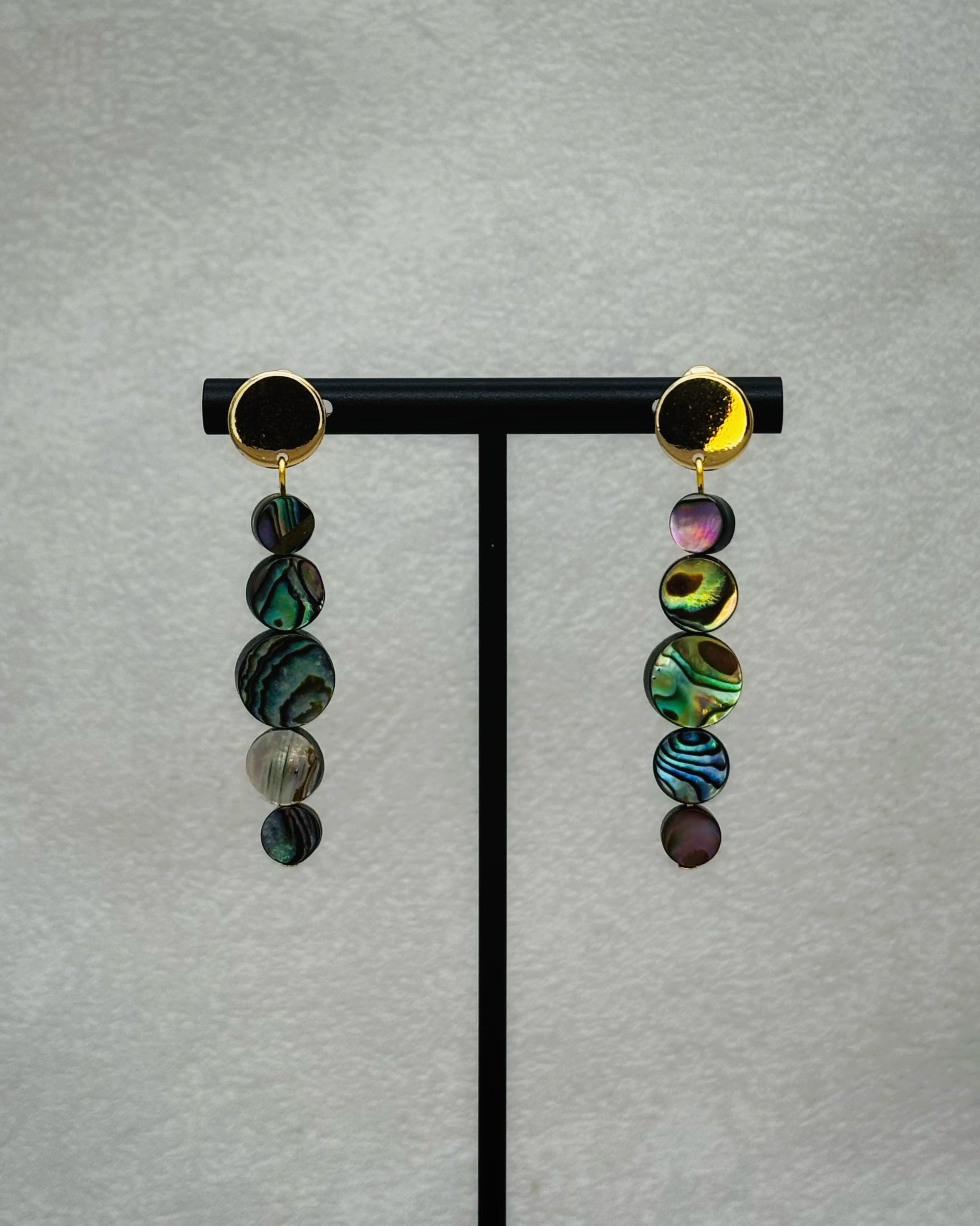Abalone Graduated Abalone Coin Gold Circle Studs with five iridescent abalone discs descending from polished gold-tone round bases