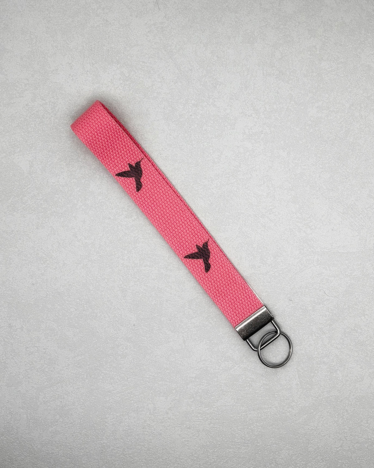 Wristlet Keychains pink beaded wristlet with black bird designs and metal key ring
