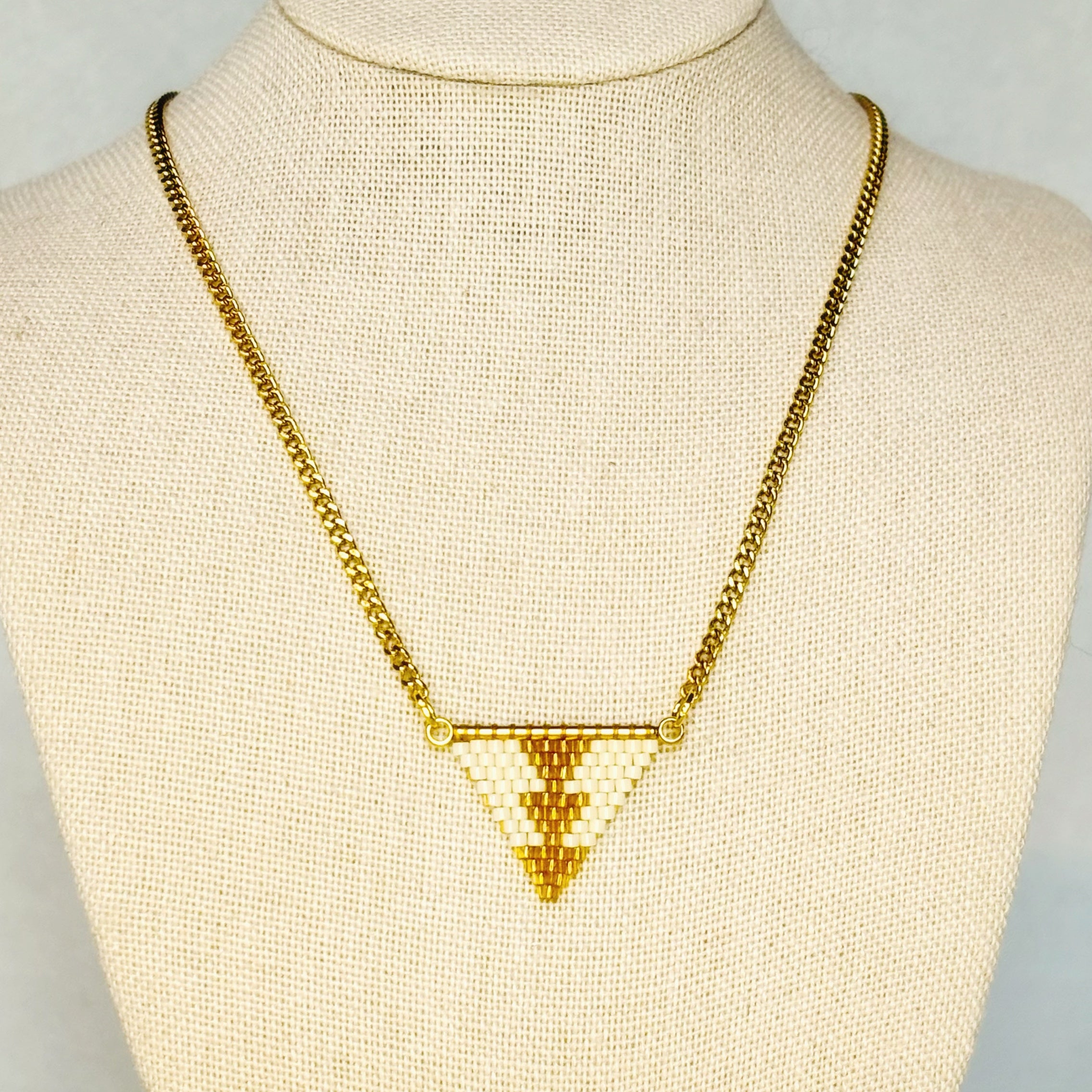 Cream and Honey Sturgeon Beaded Necklace featuring a geometric triangle pendant with basket-inspired pattern gallery position 1