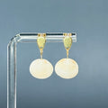Clamshell Gold Teardrop Studs featuring natural clamshell drops on delicate gold teardrop bases, 1 inch length, handmade indigenous jewelry
