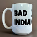 White ceramic Bad Indian Mug, Black with bold black lettering and large sturdy handle, 16 oz capacity