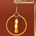 Hammered Copper Dangles with Glass Beads featuring hammered copper hoop and dual-colored white and copper glass teardrops
