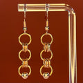 Copper Piercing Dangles featuring three linked chainmail copper rings with small bead accents, lightweight and 1.5 inch length