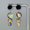 Abalone Triple Coin Silver Circle Studs featuring three iridescent abalone discs with shiny silver circle tops in a dangling design