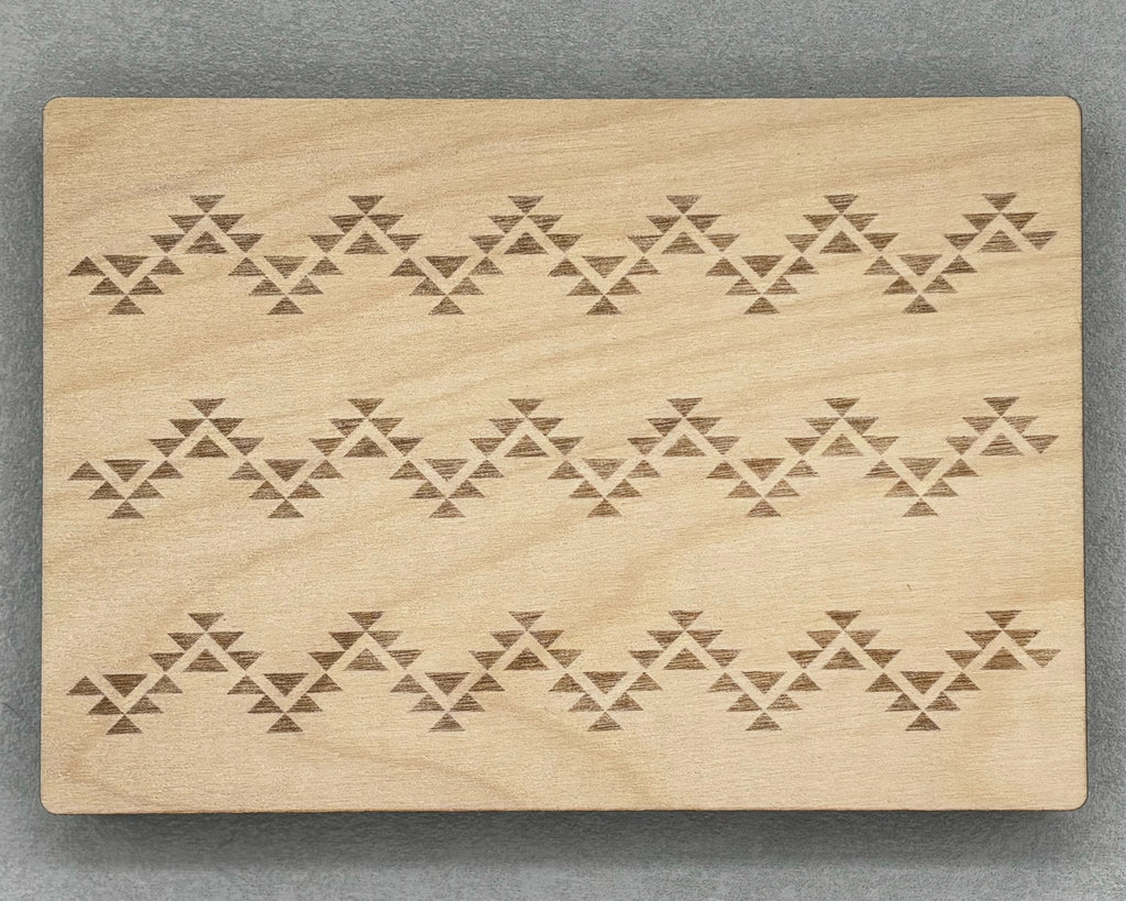 Bigger Bead Board with engraved geometric patterns on a smooth wooden surface for jewelry making.