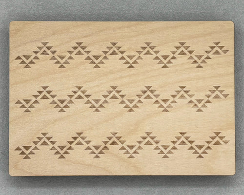 Bigger Bead Board with engraved geometric patterns on a smooth wooden surface for jewelry making.