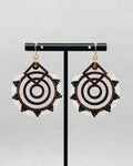 Walnut Brick Stitch Hoop Dangles featuring intricate beadwork with white, black, and brown accents on wooden hoops